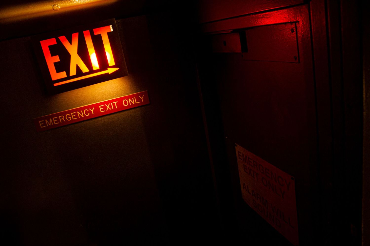 Abstract dark photo of exit sign