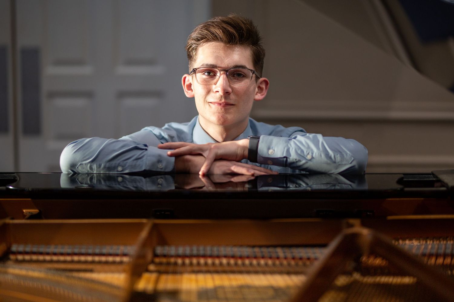 Senior picture of young man with a piano