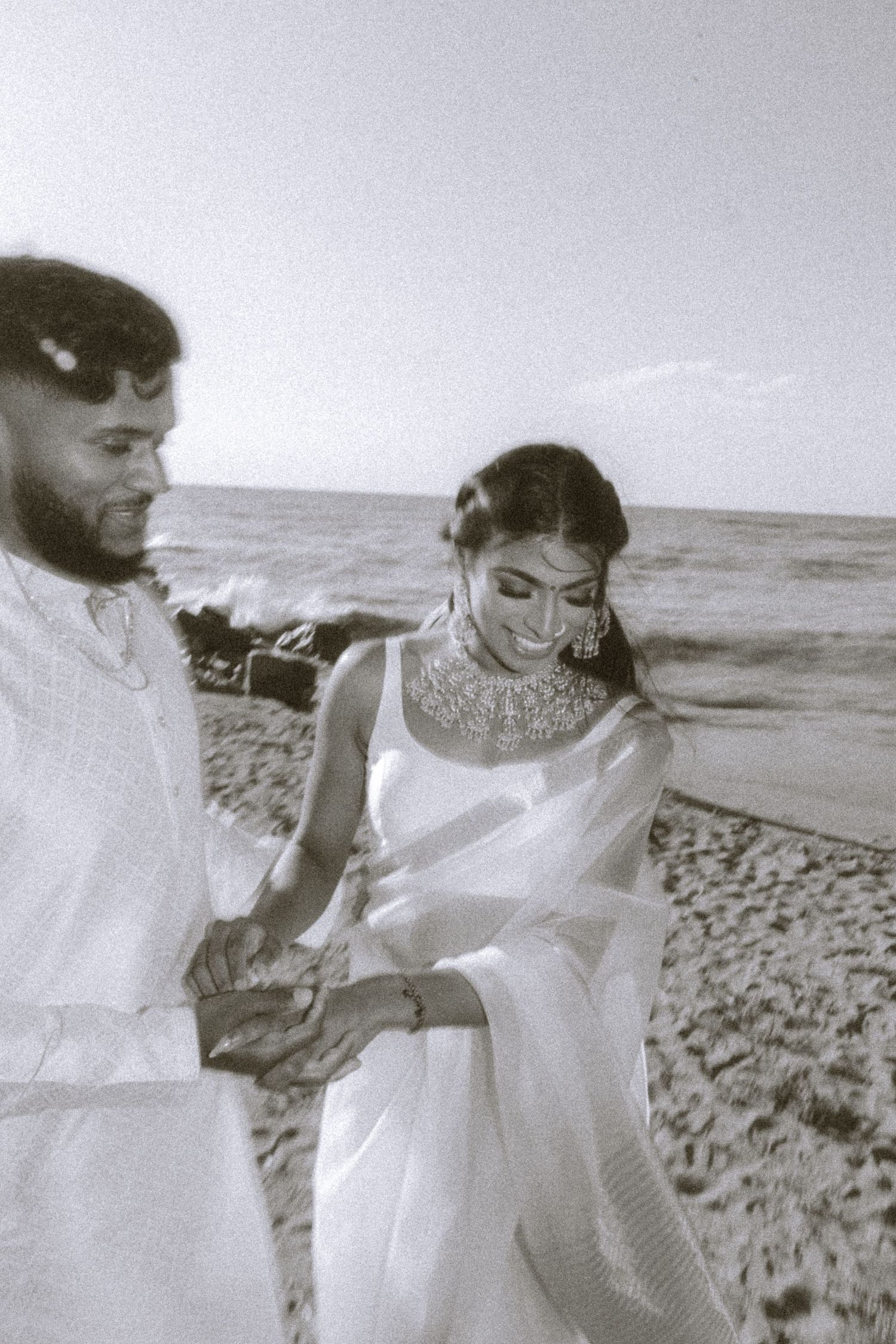 A romantic black and white beach photoshoot sequence.