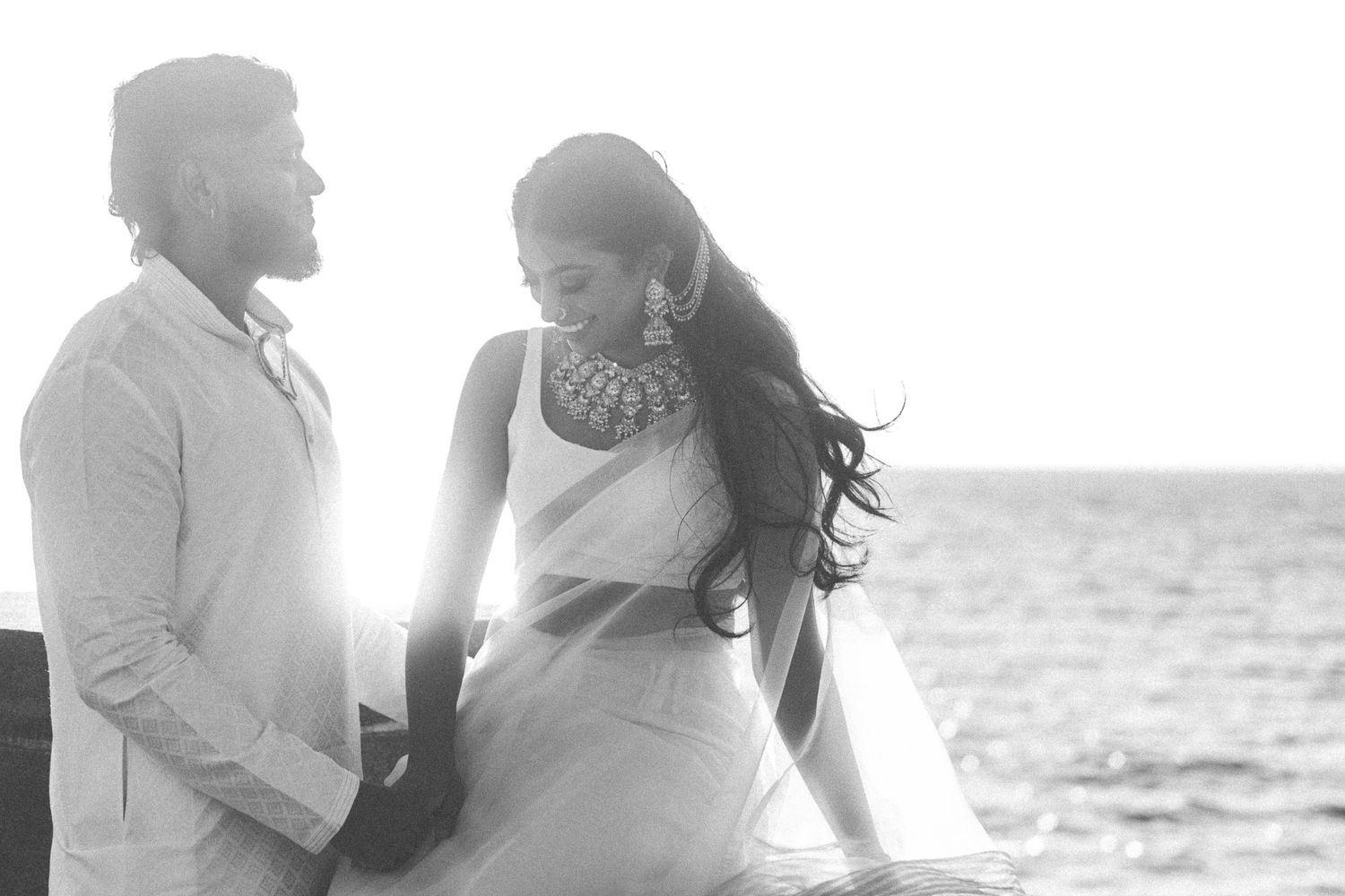 Black and white romantic portraits by the ocean.