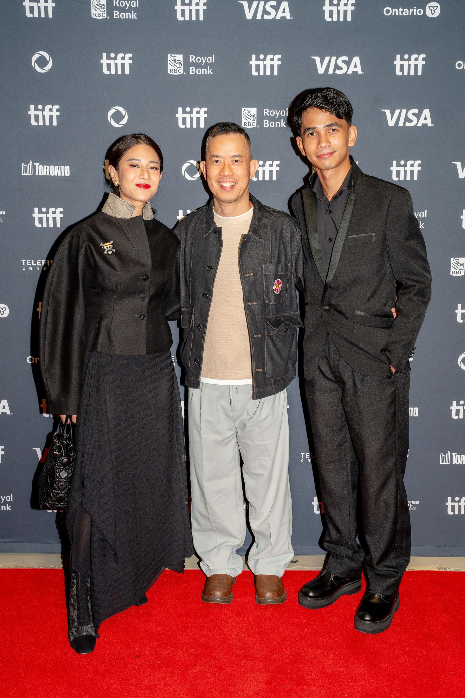 Red carpet event at TIFF film festival with sponsors and branding visible.