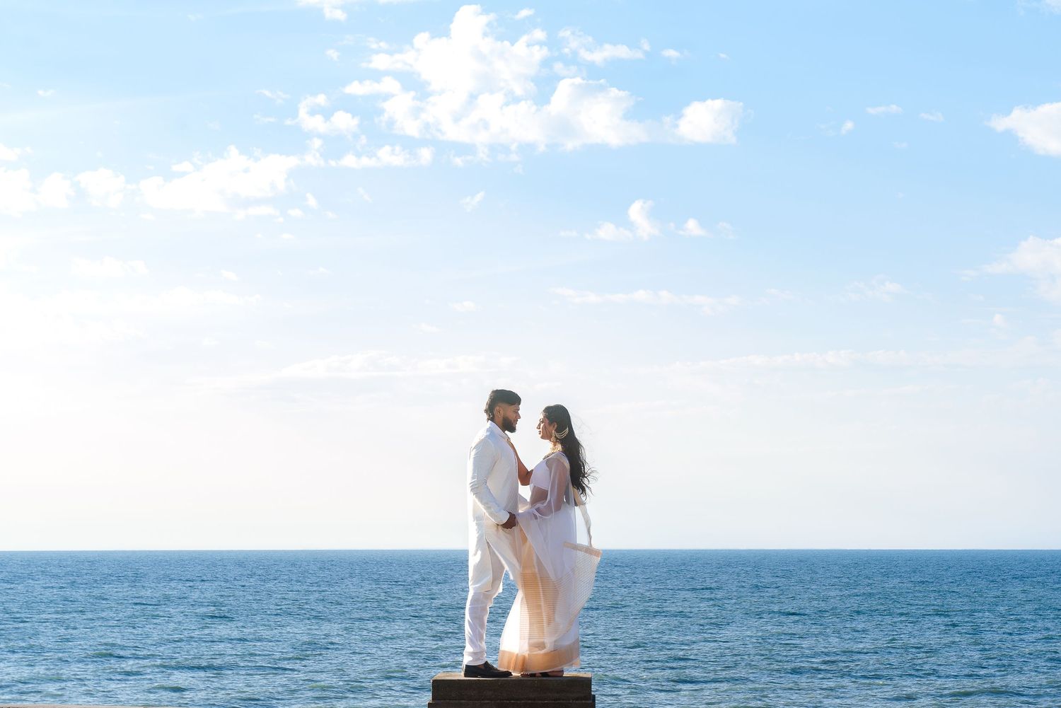 Couple enjoying scenic ocean views on bright sunny day.