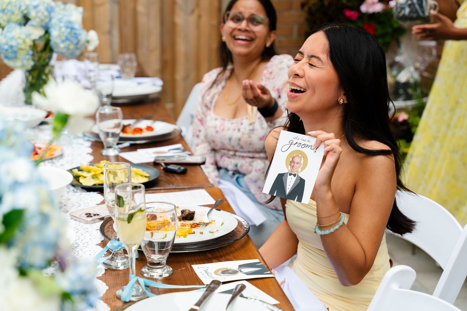 Party guests laughing and enjoying themselves at an outdoor celebration.