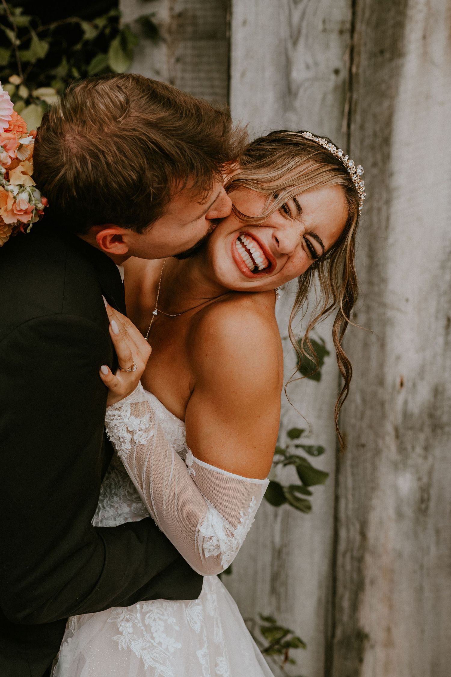 A romantic wedding moment captured in a series of photos showing tender embraces against a rustic backdrop with greenery.