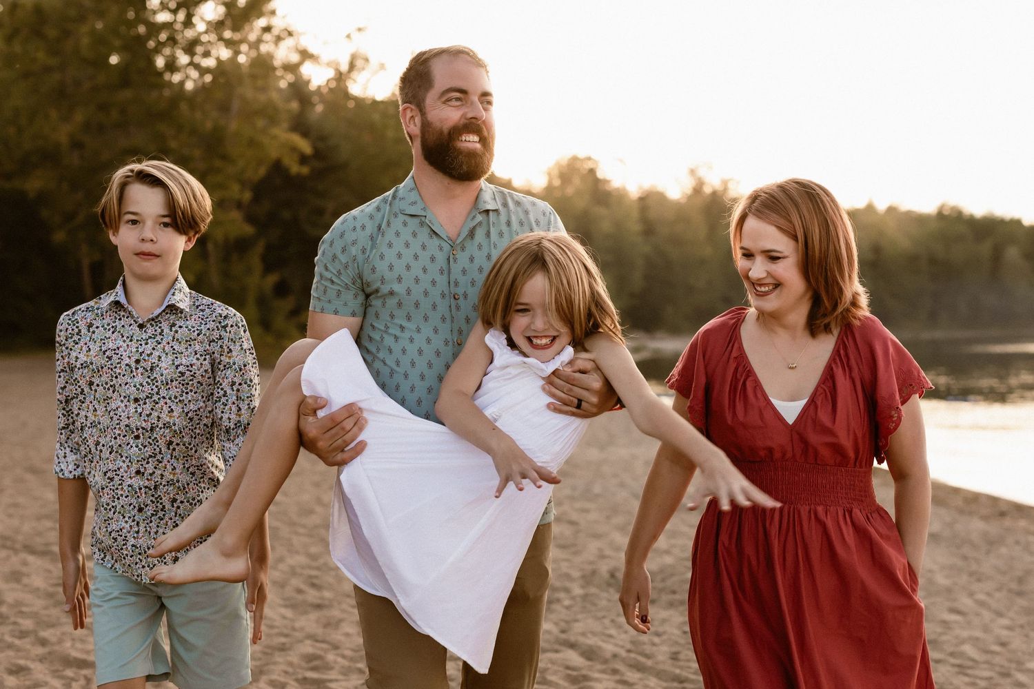 family of four walking through beach at Pigeon Lake Family Photography