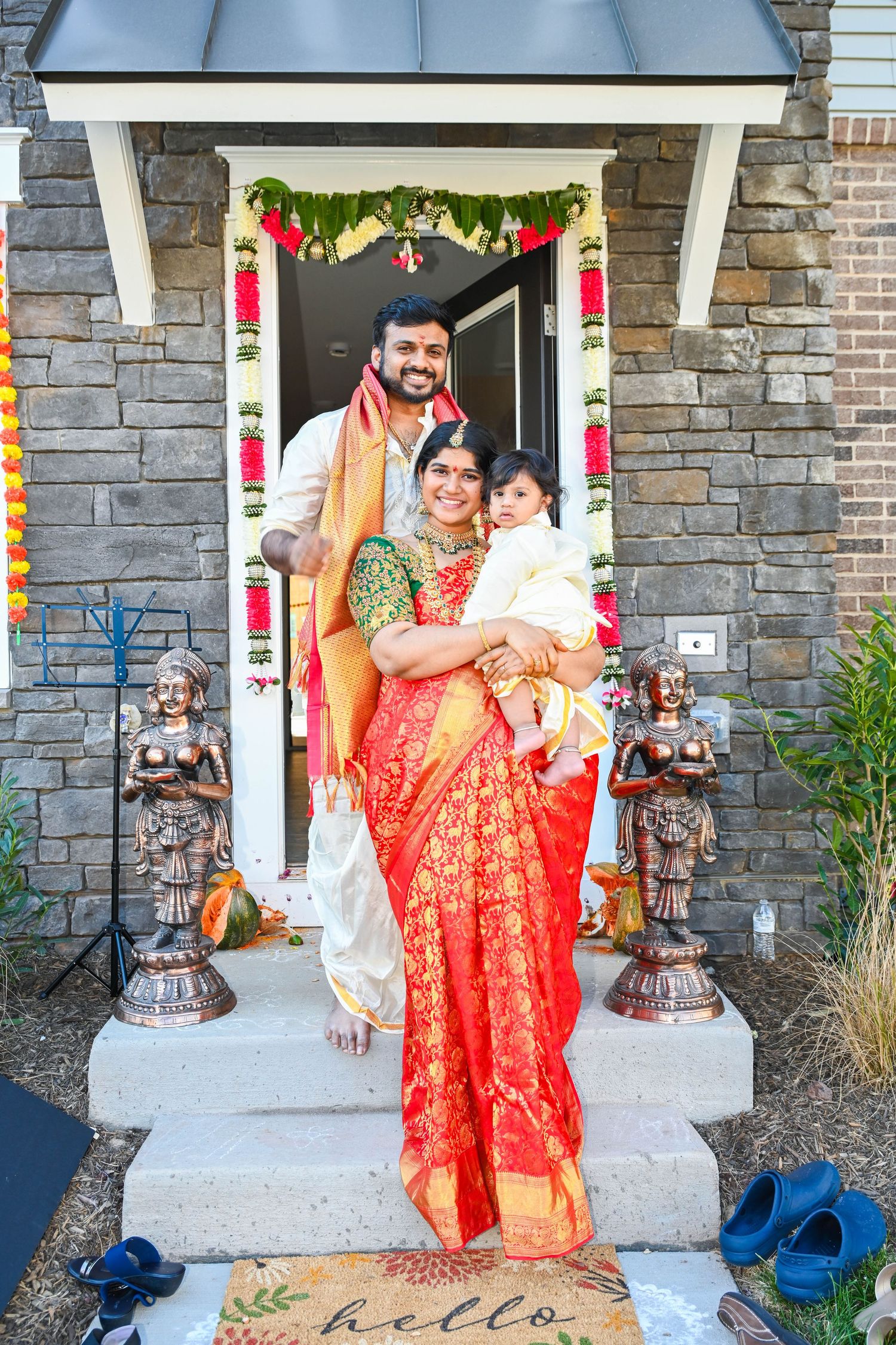 Family gathered together for a memorable photo in front of their new house.