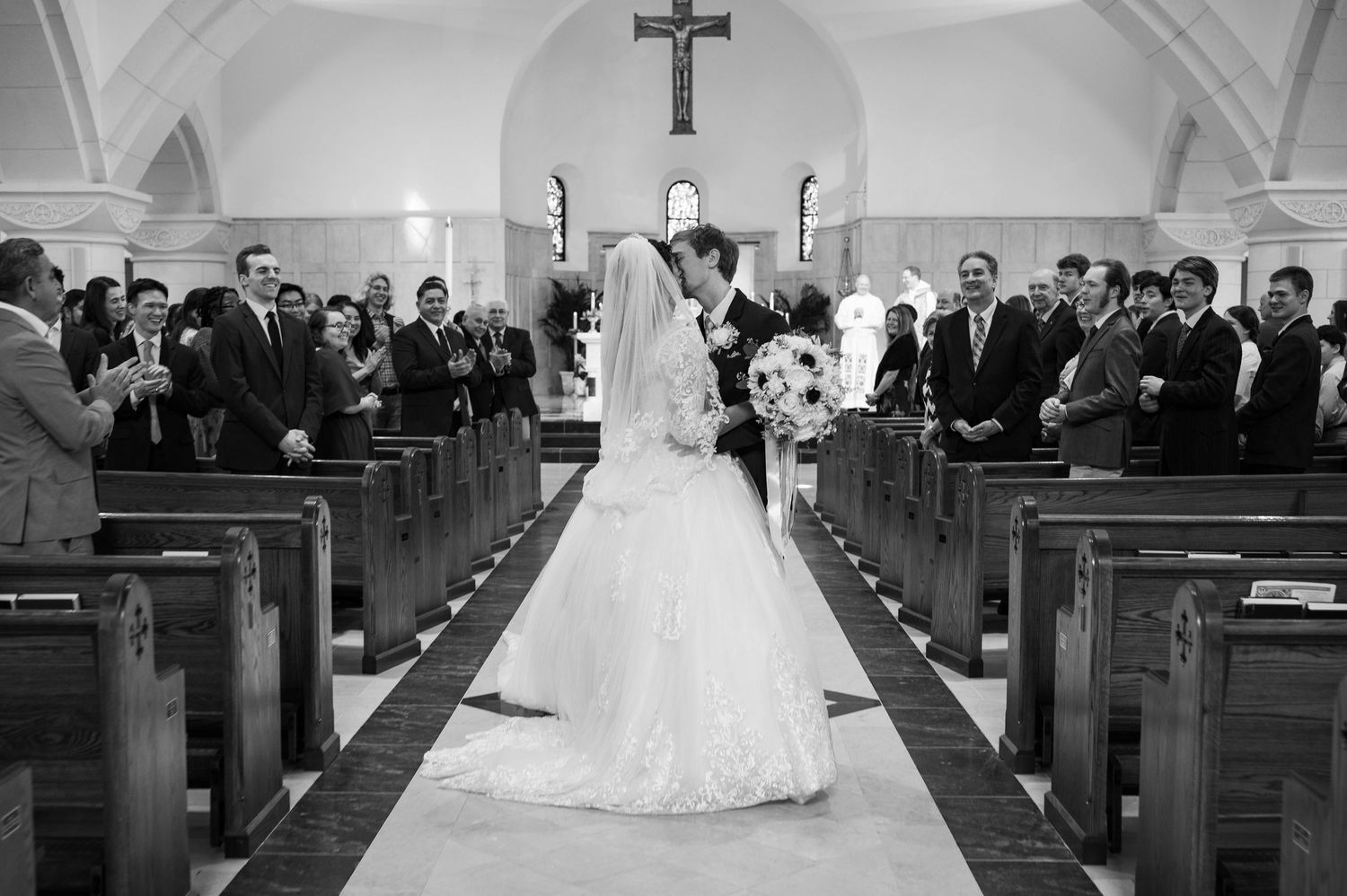 Elegant wedding ceremony kisses beautifully preserved during the most meaningful moments of the day.