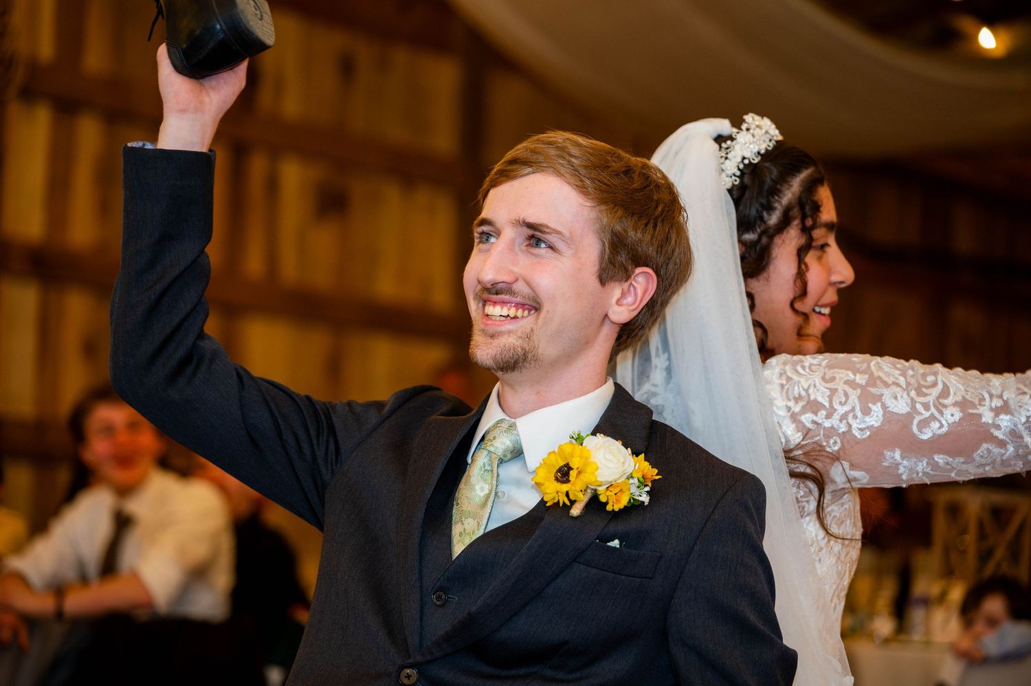 Groom showing off an authentic smile during the fun shoe game.