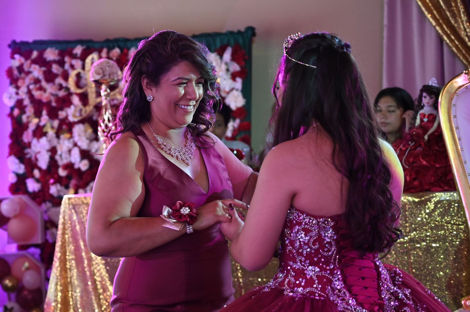Sweet mother and daughter dance moment with the mother smiling during the reception.