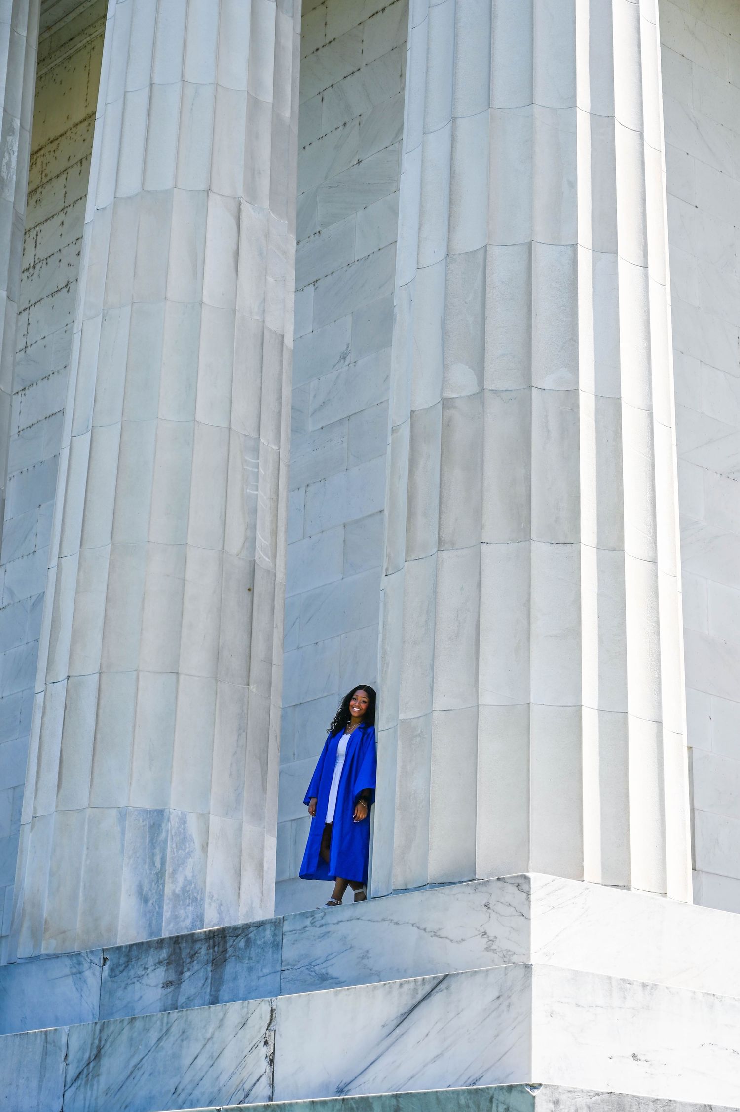 Elegant senior portraits on the steps of the Lincoln Memorial with a timeless and iconic backdrop.