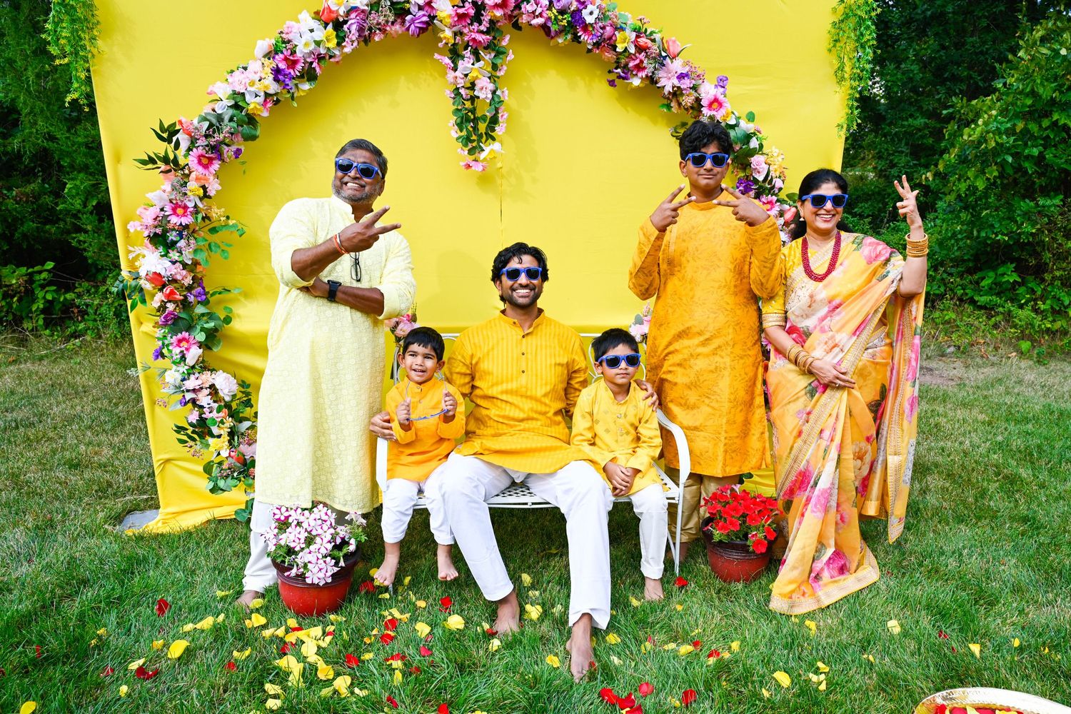 Fun family photo with everyone wearing sunglasses and enjoying the festivities.