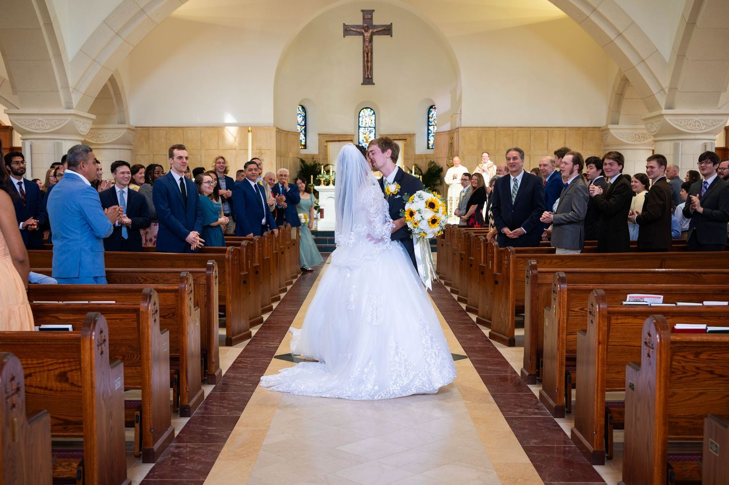 Elegant wedding ceremony kisses beautifully preserved during the most meaningful moments of the day.