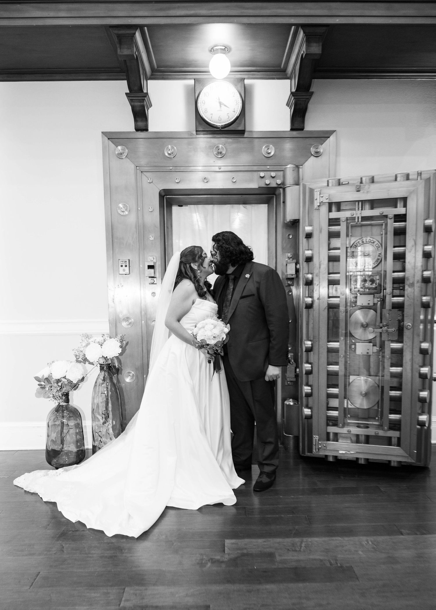 Newlyweds sharing their first kiss after saying “I do.”
