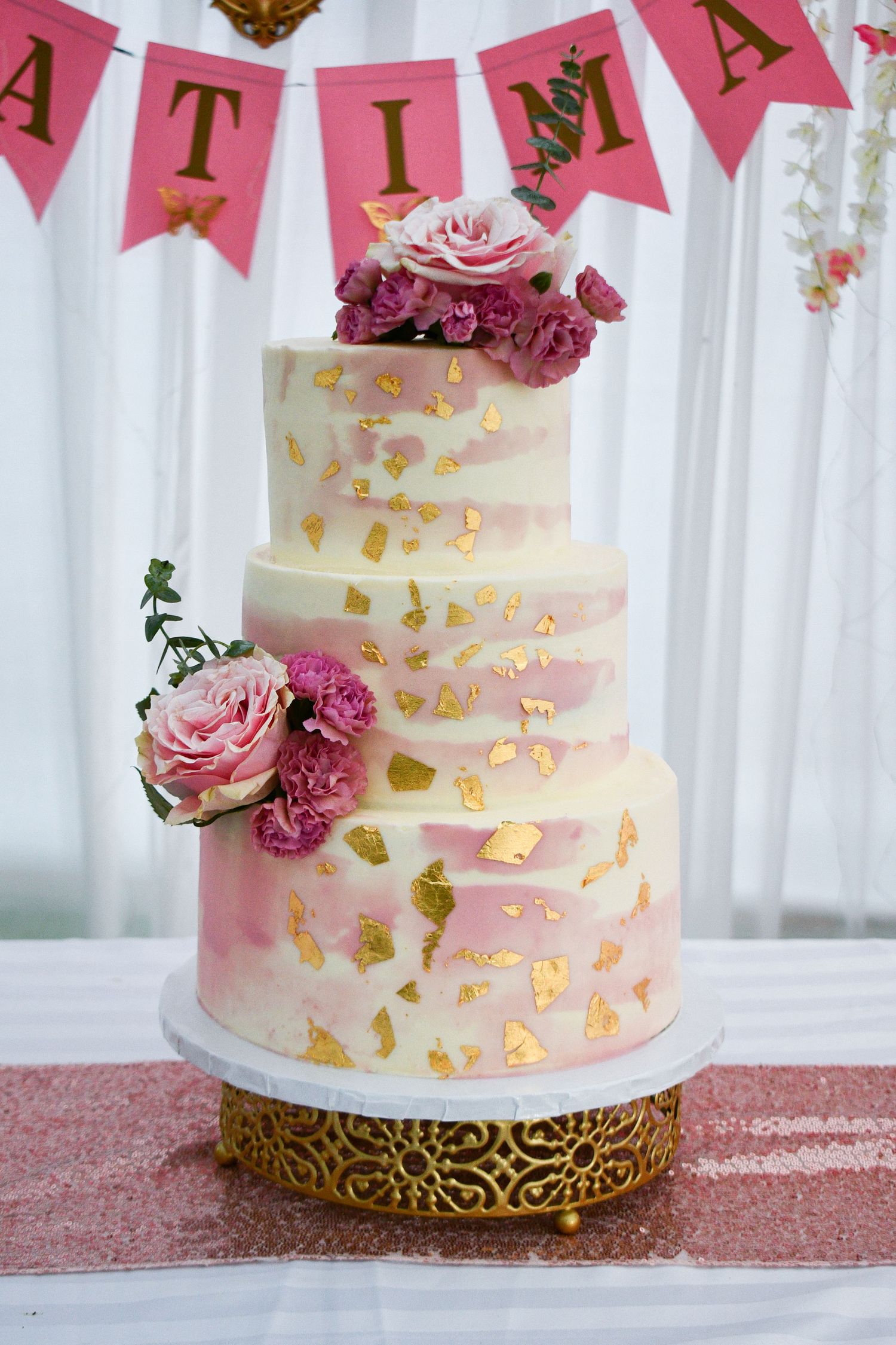 Elegant display of the quinceañera cake before the celebration begins.