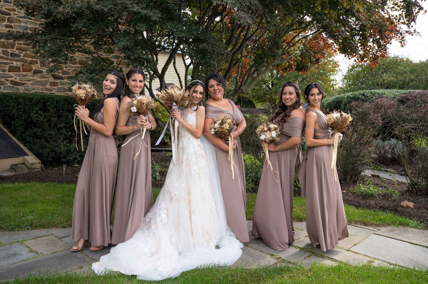 Fun and joyful photo of the bride celebrating with her bridesmaids.