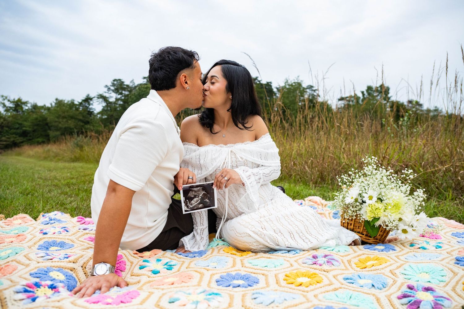 Romantic maternity kisses paired with sonogram photos to celebrate the journey into parenthood.