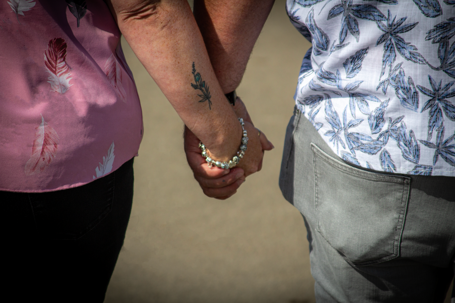 Series of close-up shots showing joined hands and tender moments.