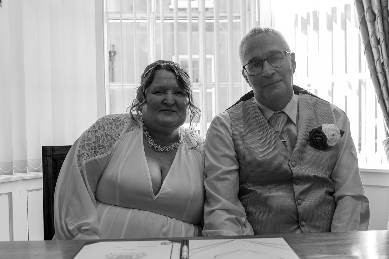 Black and white portrait series of wedding party members indoors.