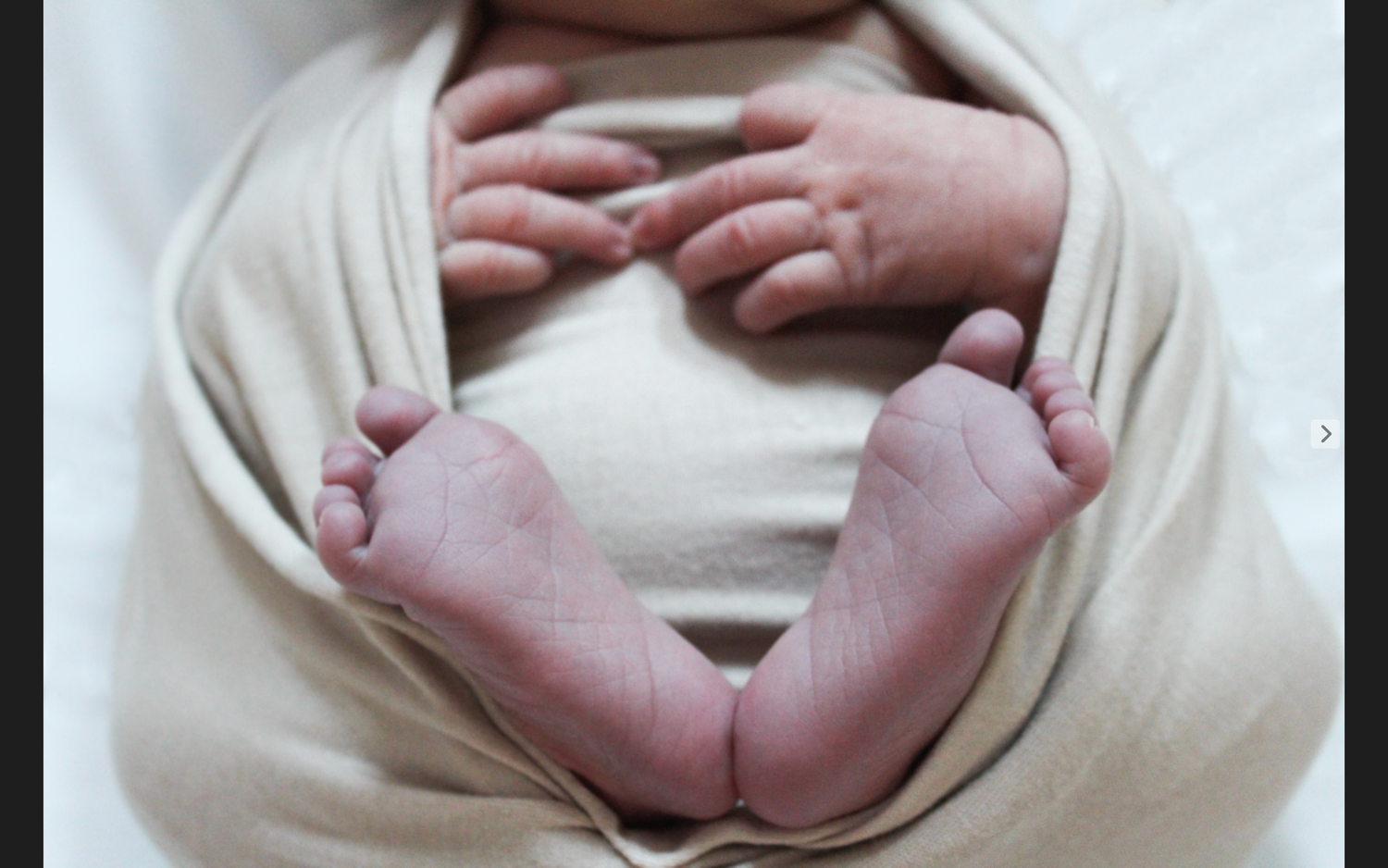 Multiple angles of newborn feet wrapped in soft cream-colored fabric.
