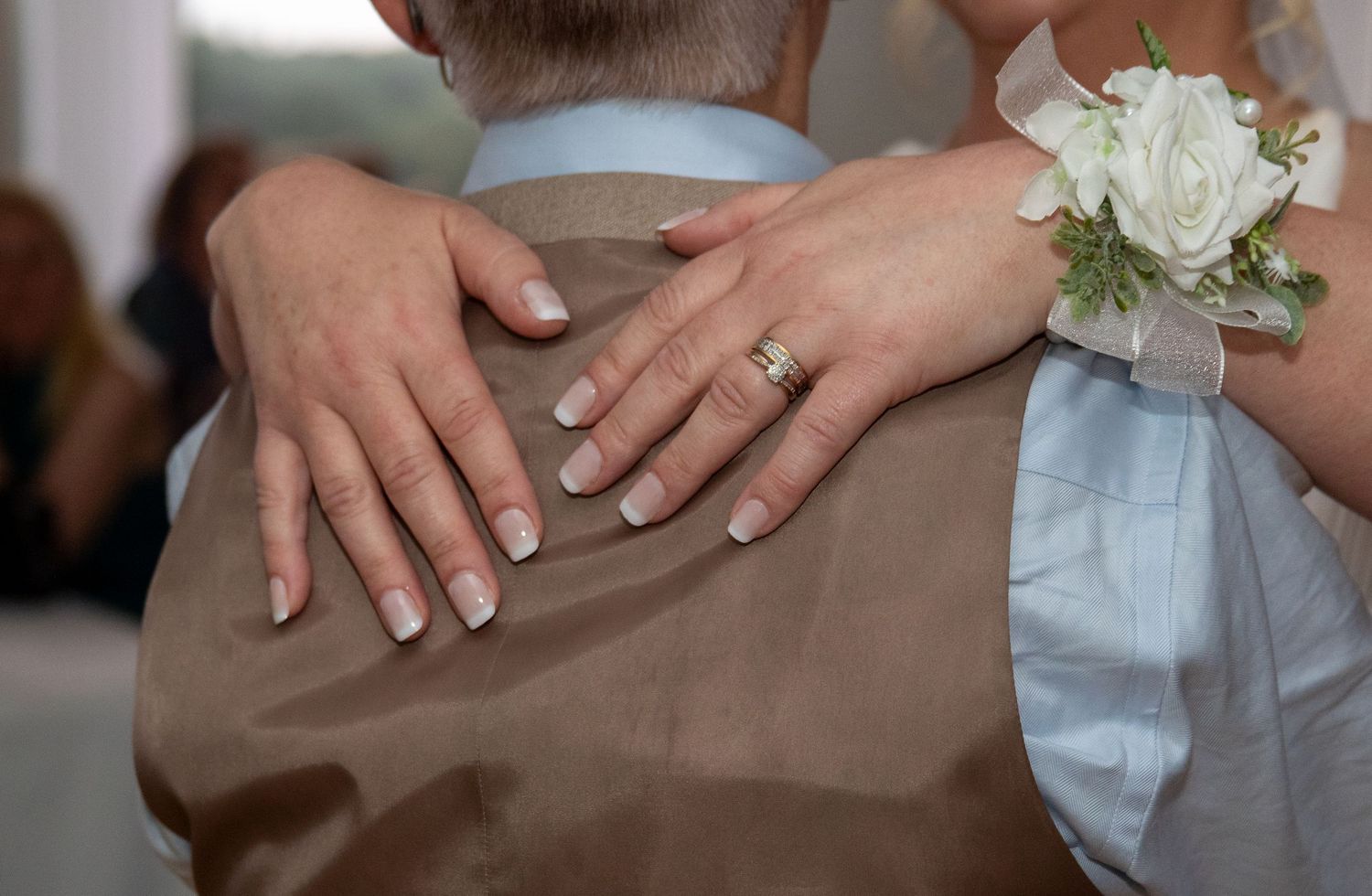 Close-up shots of hands wearing wedding rings against various backgrounds.