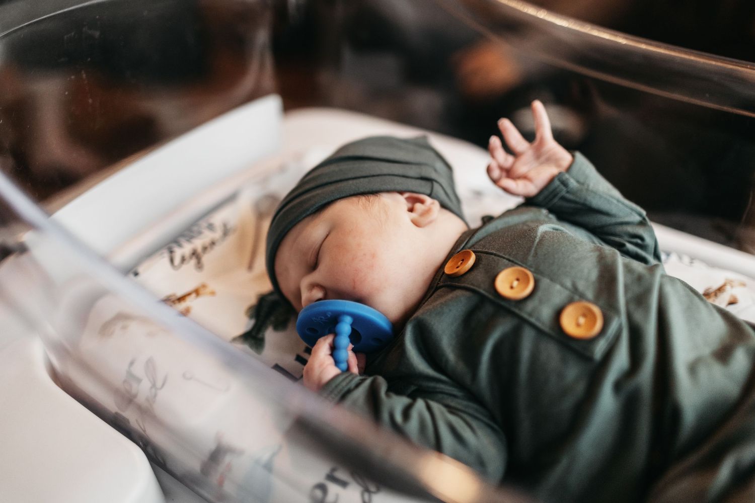 Sleeping baby details captured in soft natural light.