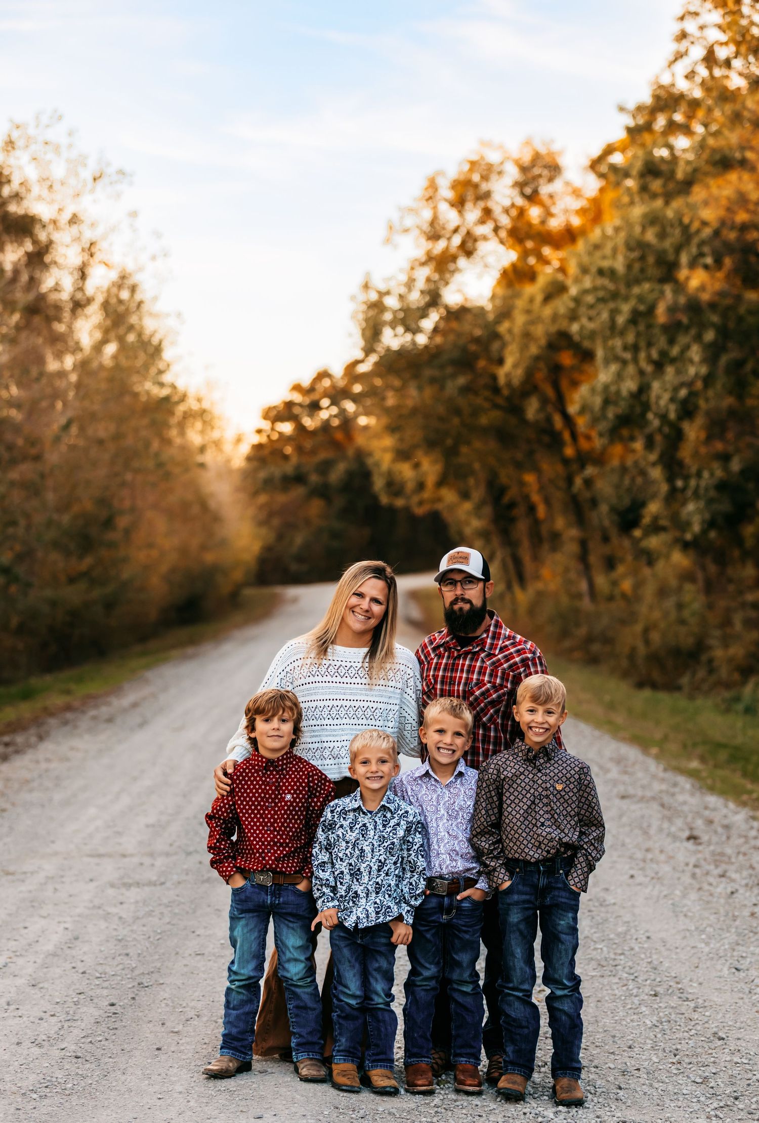 A large family of 6 on country road during golden hour in Edgerton, Missouri.