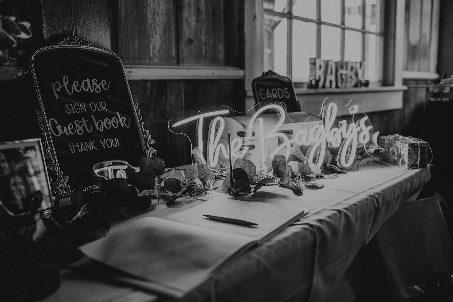 Rustic chalkboard menu signs displayed at a wedding reception venue.