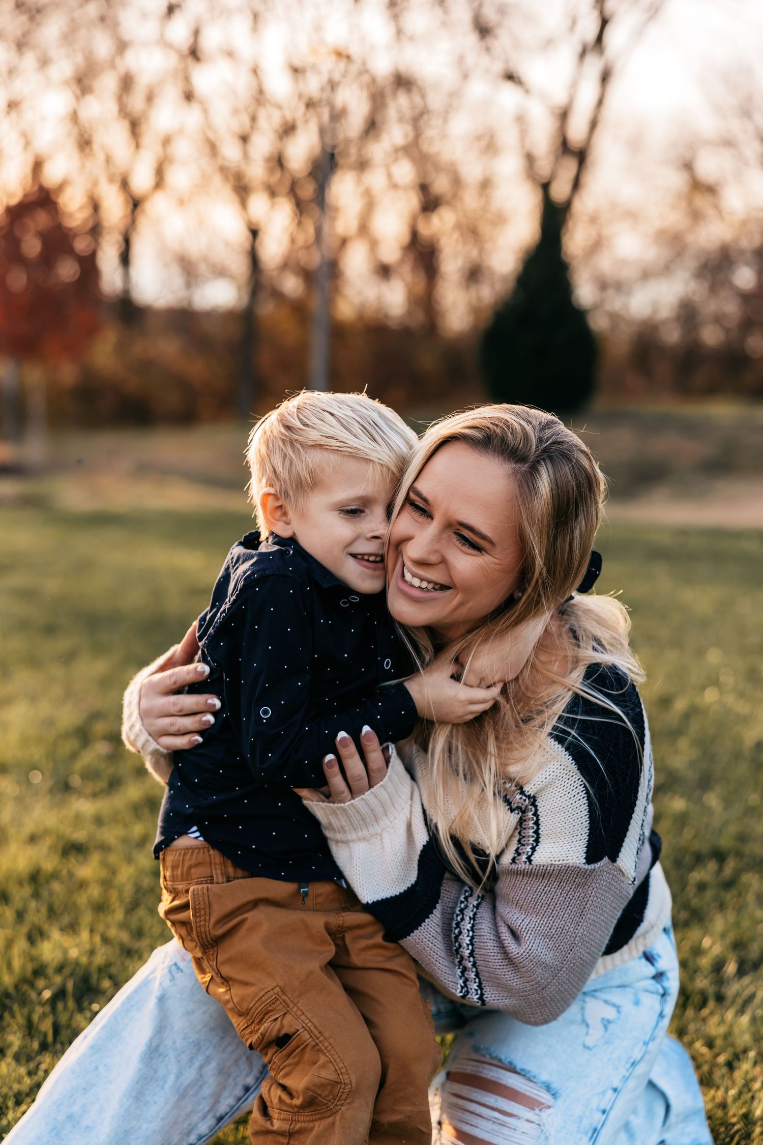 Playful outdoor family portrait session in natural golden light.