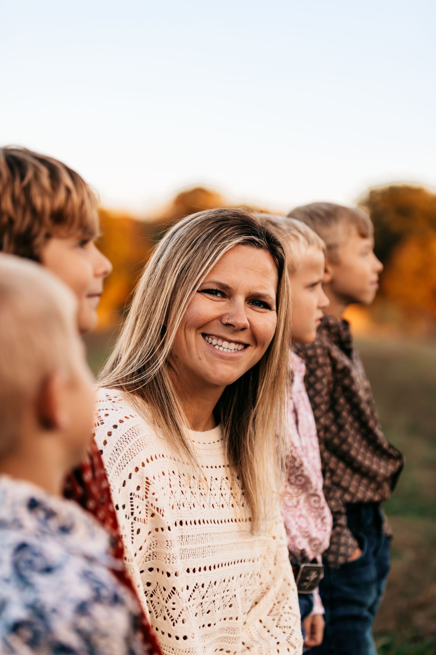 A candid outdoor portrait series showing mom smiling at sunset.