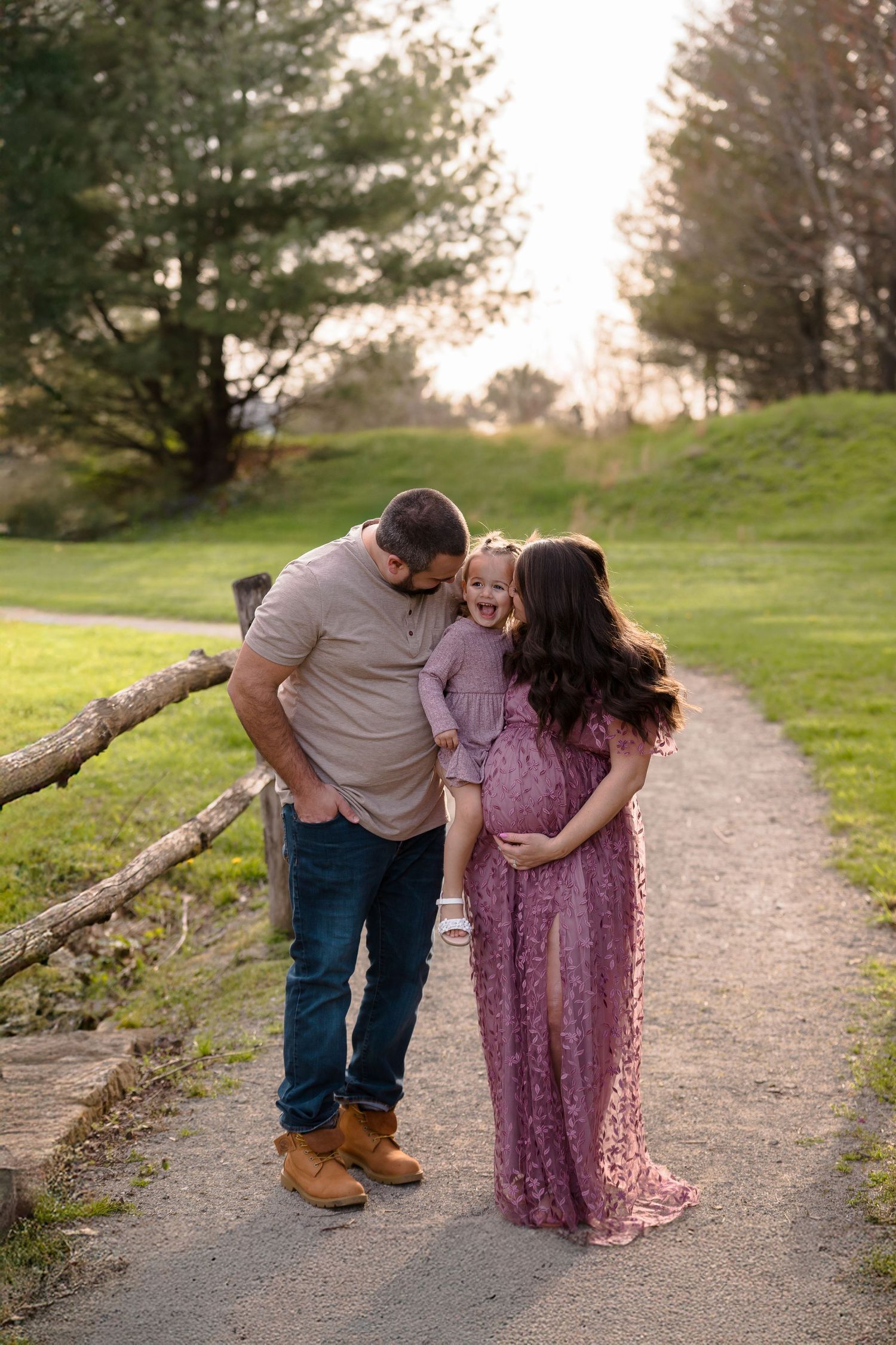 A tender family moment captured on a scenic trail during golden hour.