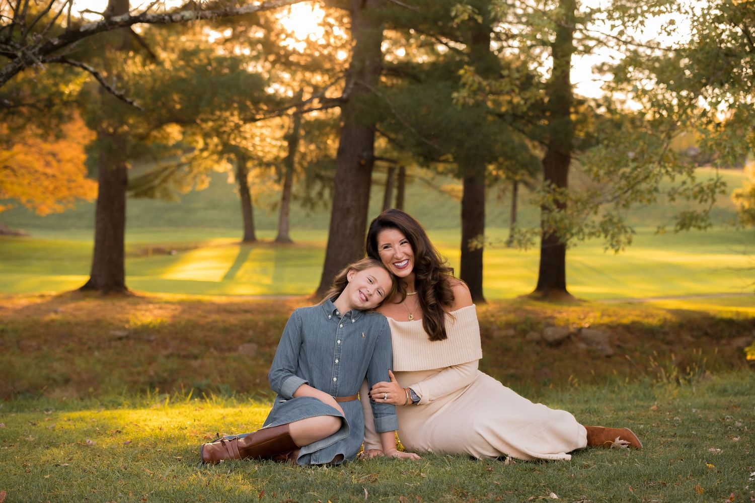 A series of intimate family portraits captured in a sunlit park with tall trees in the background.