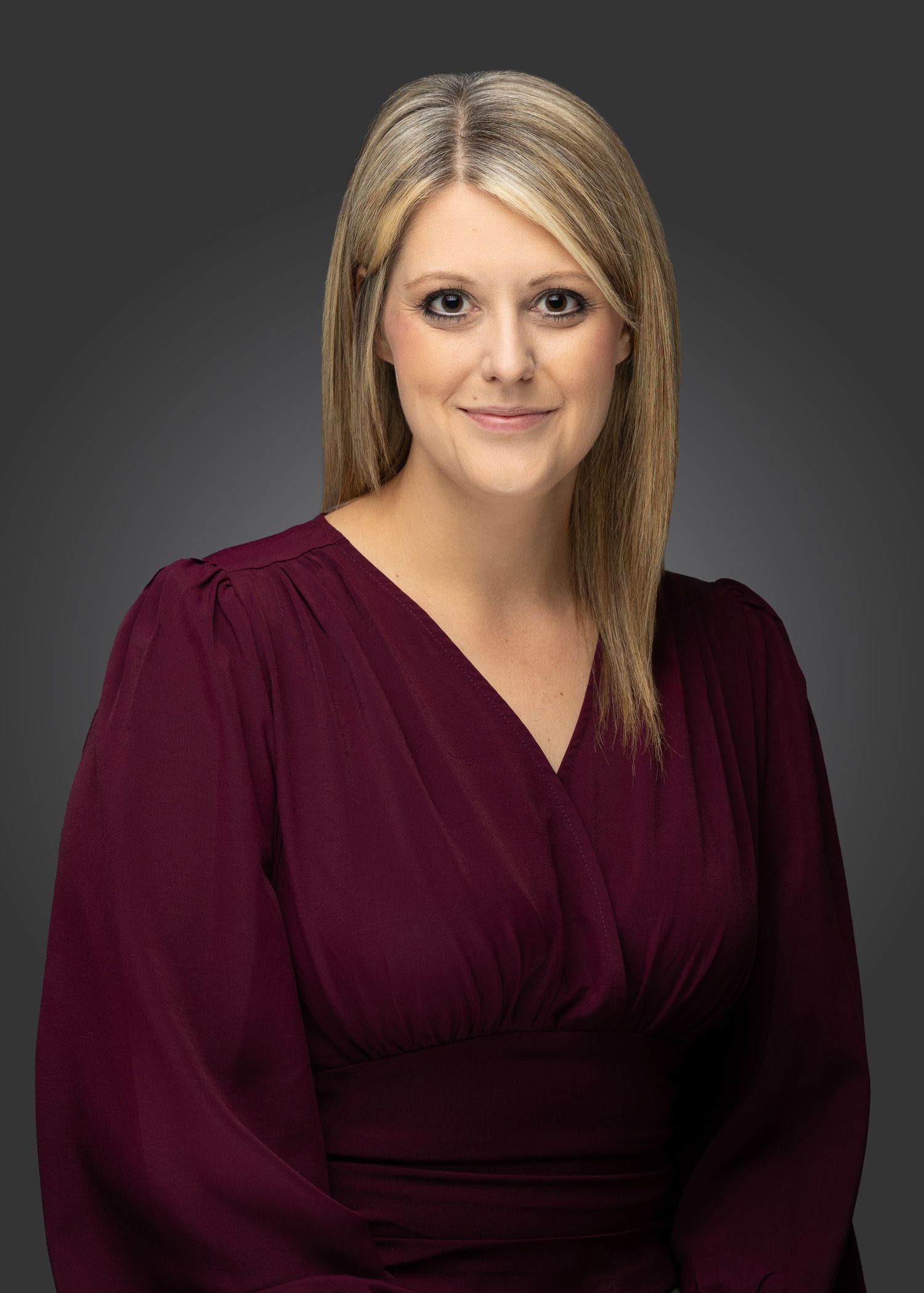 Professional headshots of someone wearing a burgundy top against a dark background.