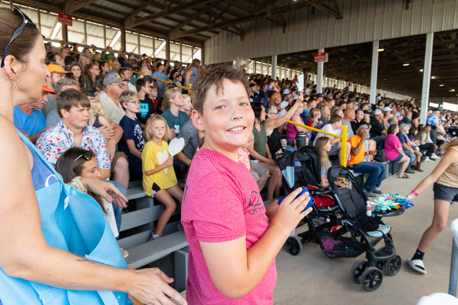 Crowd of spectators at outdoor stadium or venue.