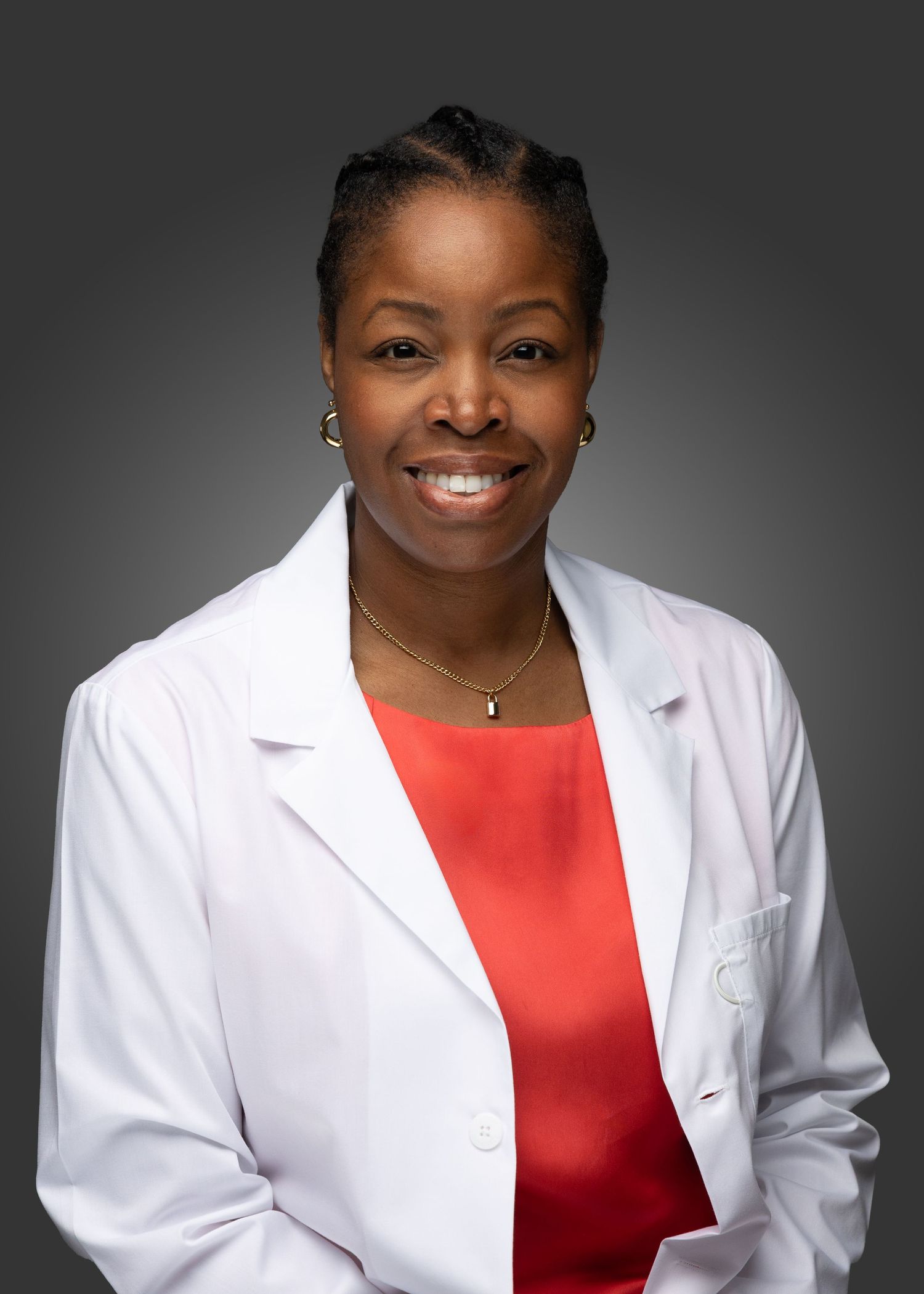 Professional headshots in a white coat and red top against a dark background.