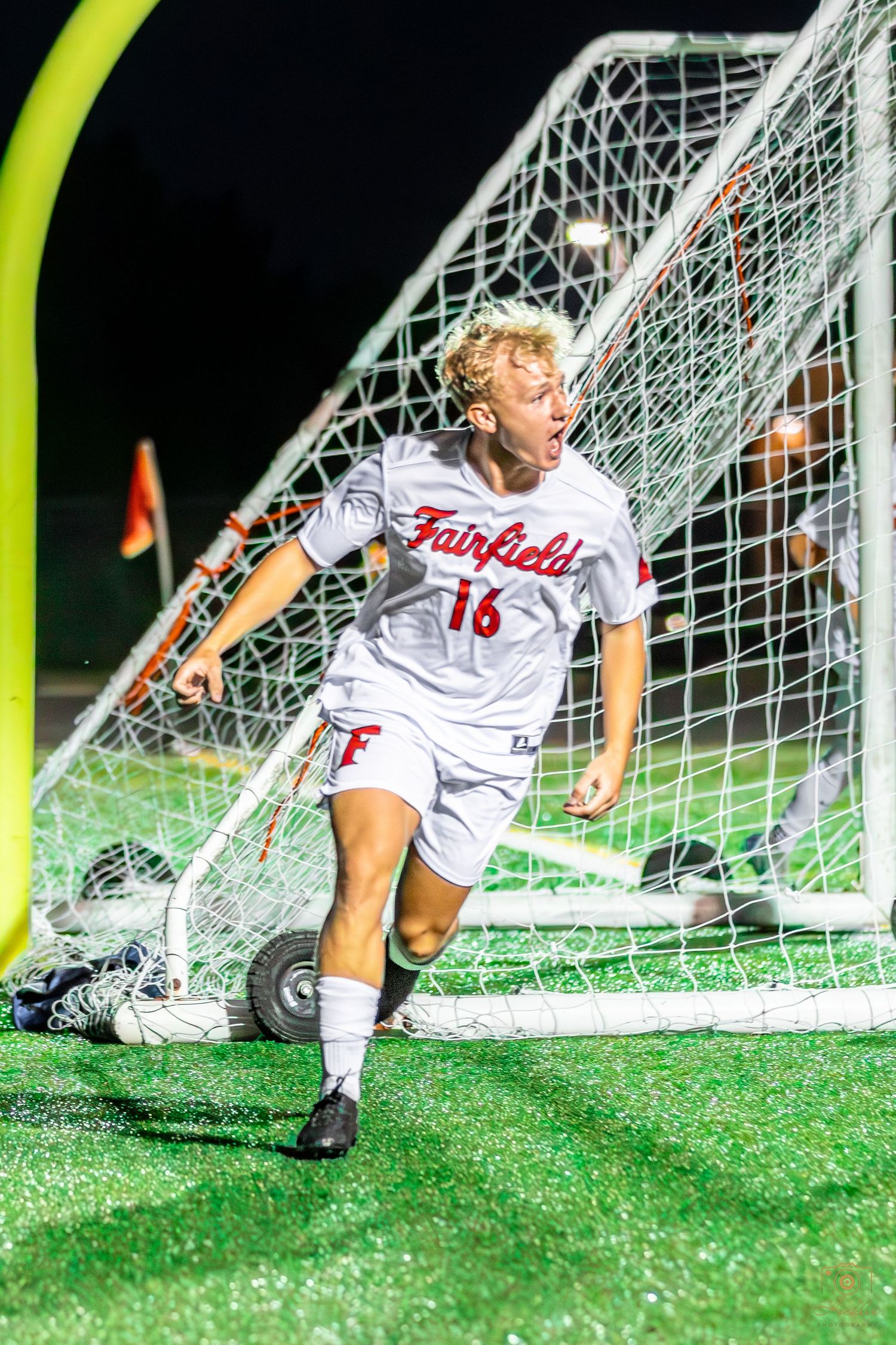 Soccer player celebrating after a goal.