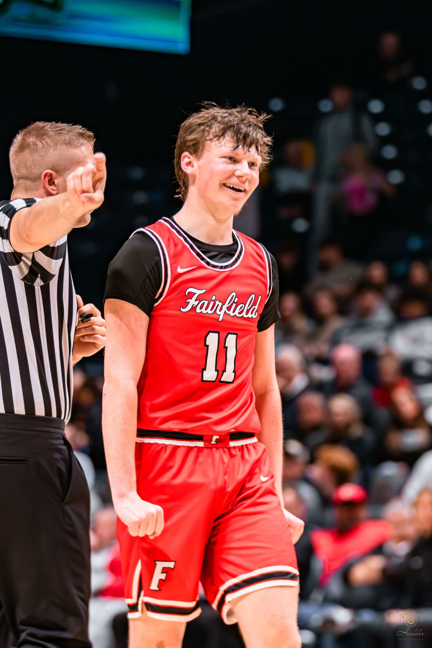Basketball player celebrating after he scored.