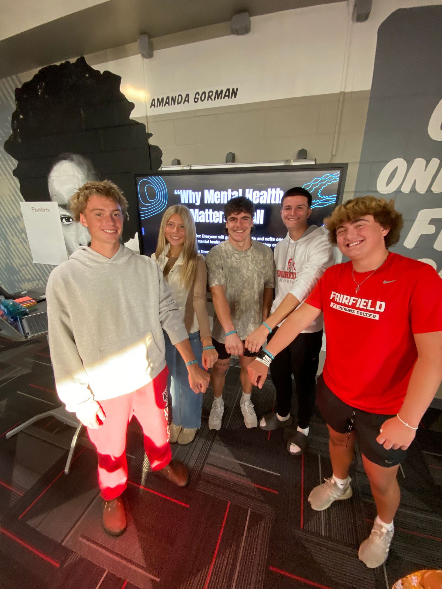 Group of friends smiling at camera.