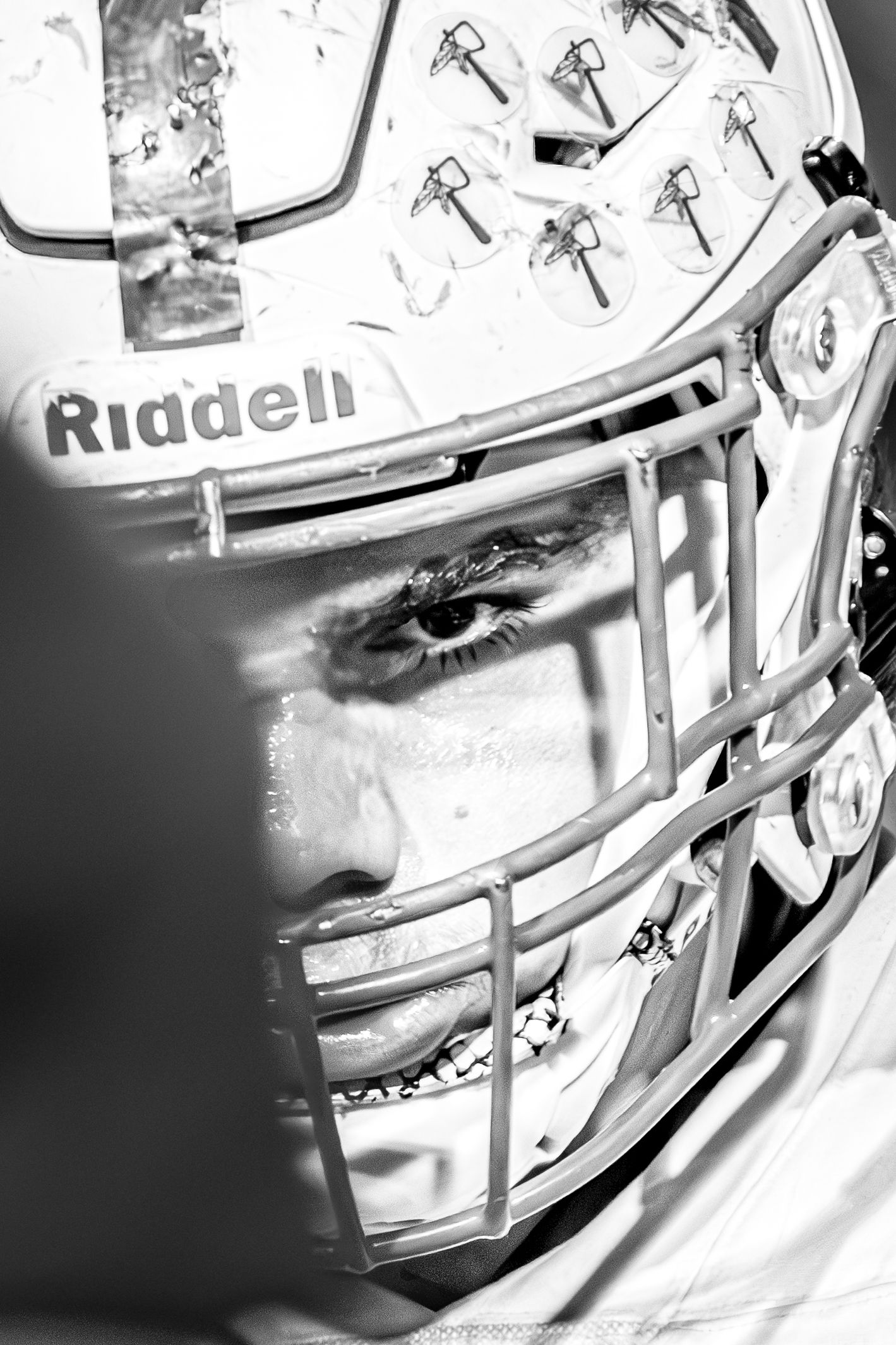 Close up of a football player breathing and calming down.