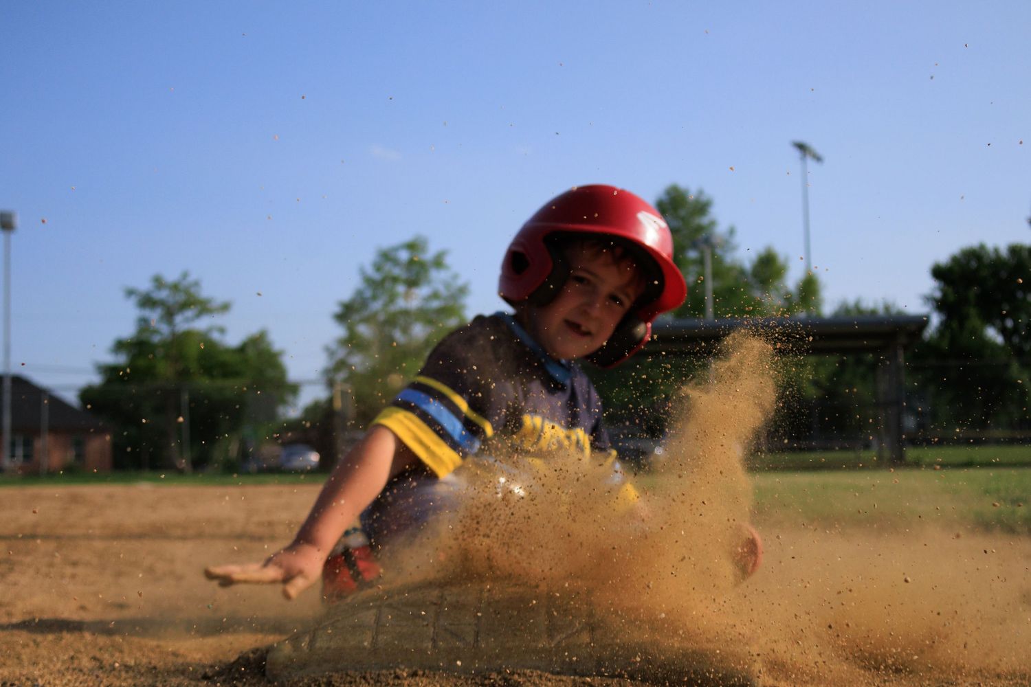 Youth Baseball player sliding portrait