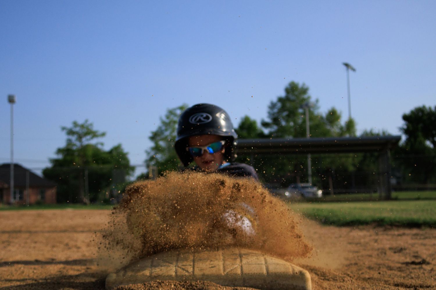 Youth Baseball player sliding portrait