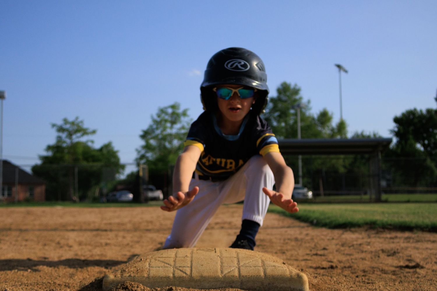 Youth Baseball player sliding portrait