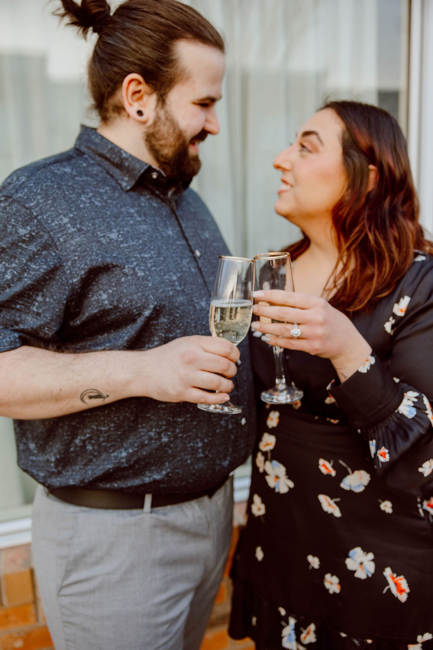 Romantic couple toasting with champagne while sharing an intimate moment.