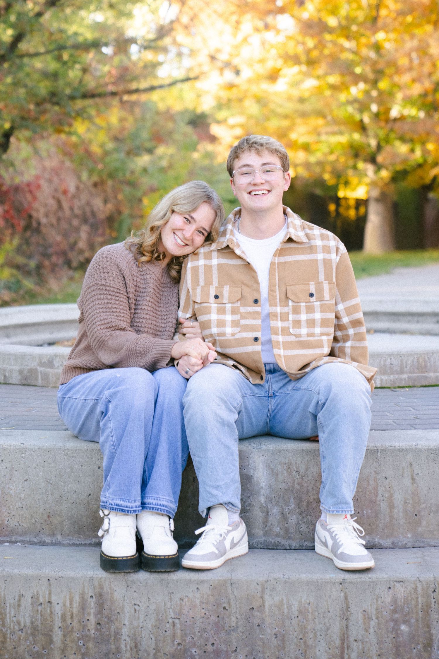 Couples photography session at Liberty Park, Salt Lake City with vibrant fall leaves