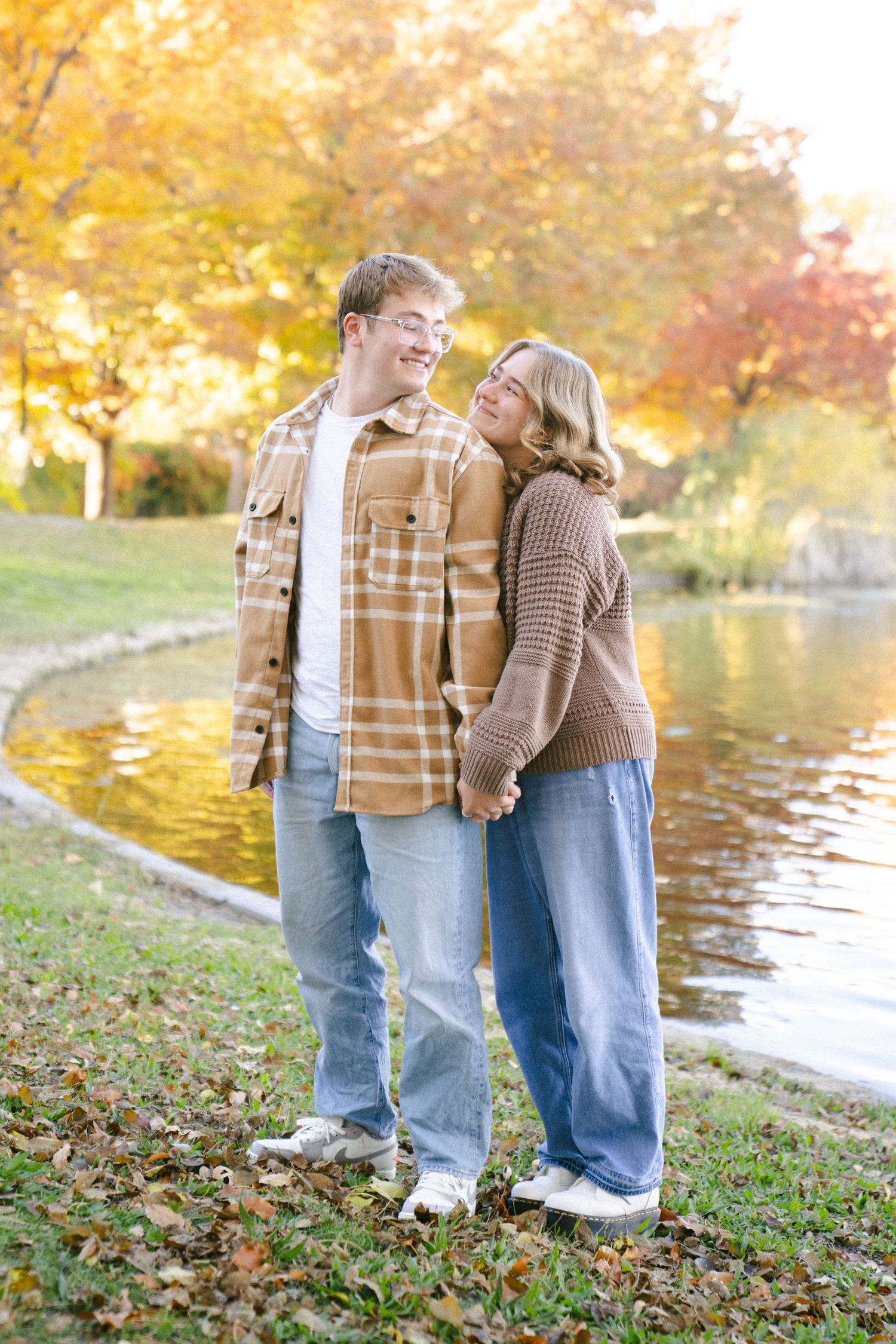 Salt Lake City engagement photography with couple laughing in a park