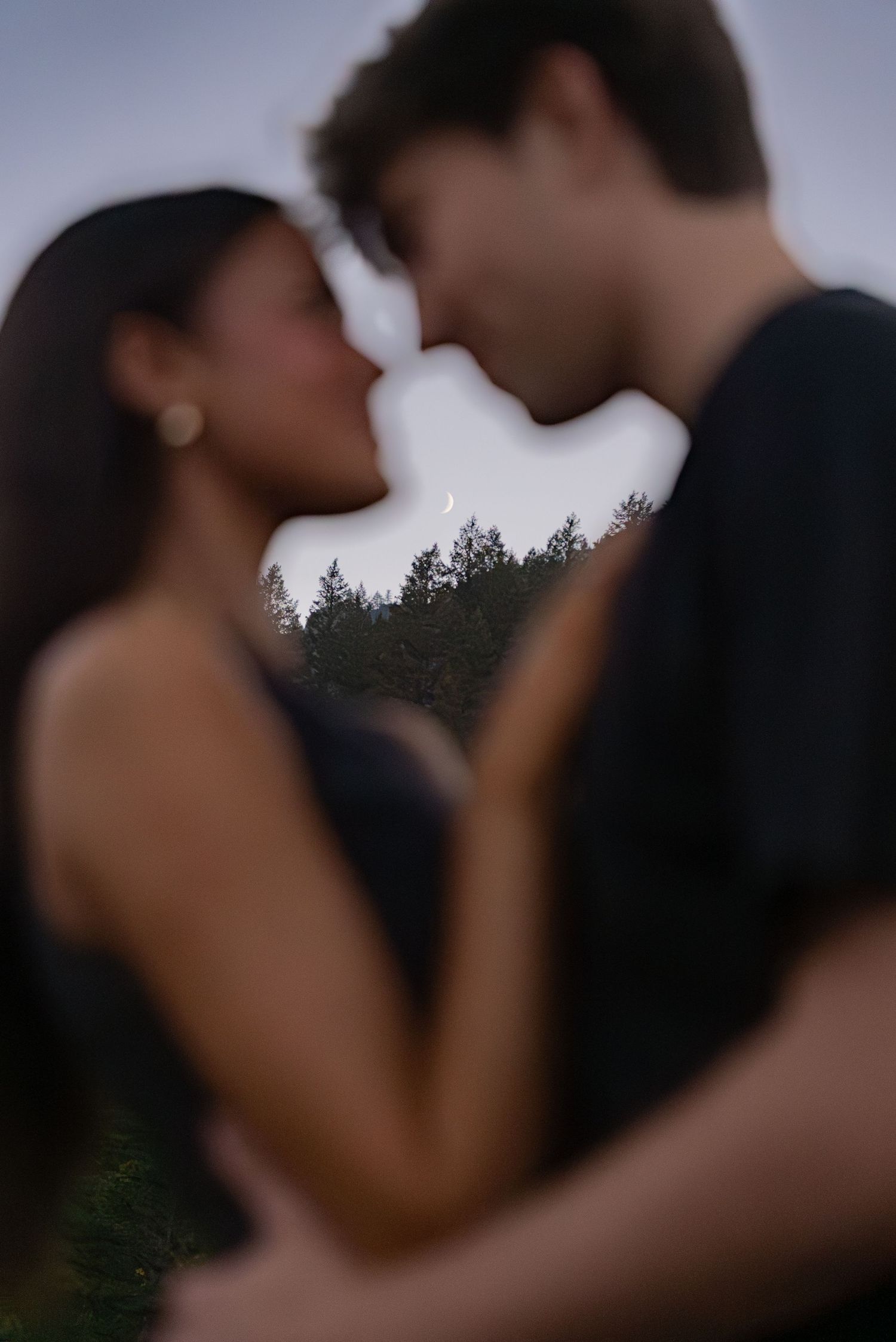 Engagement photos in Utah mountains with couple laughing on trail