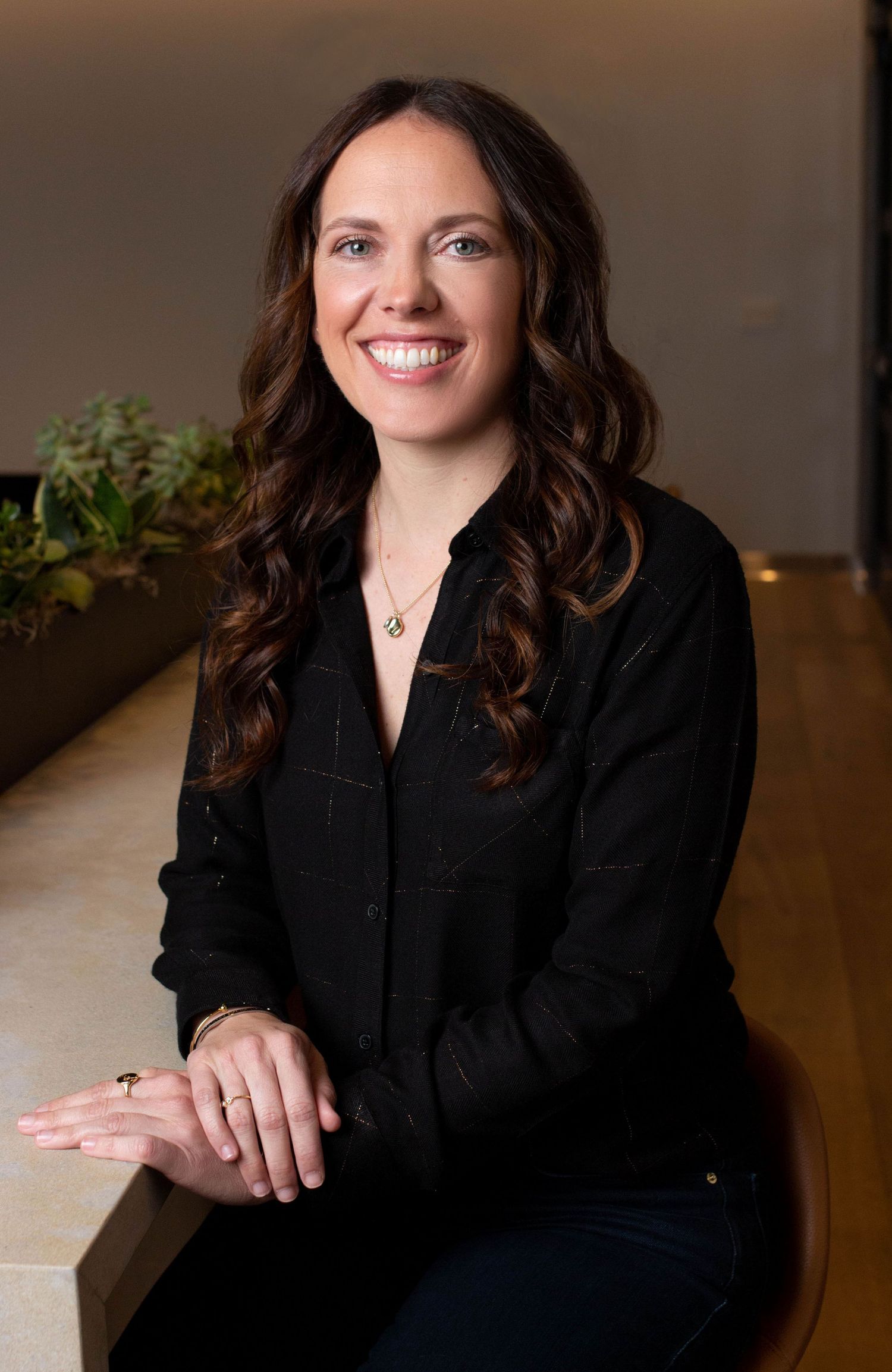 Empowered female entrepreneur posing confidently for a personal branding shoot.