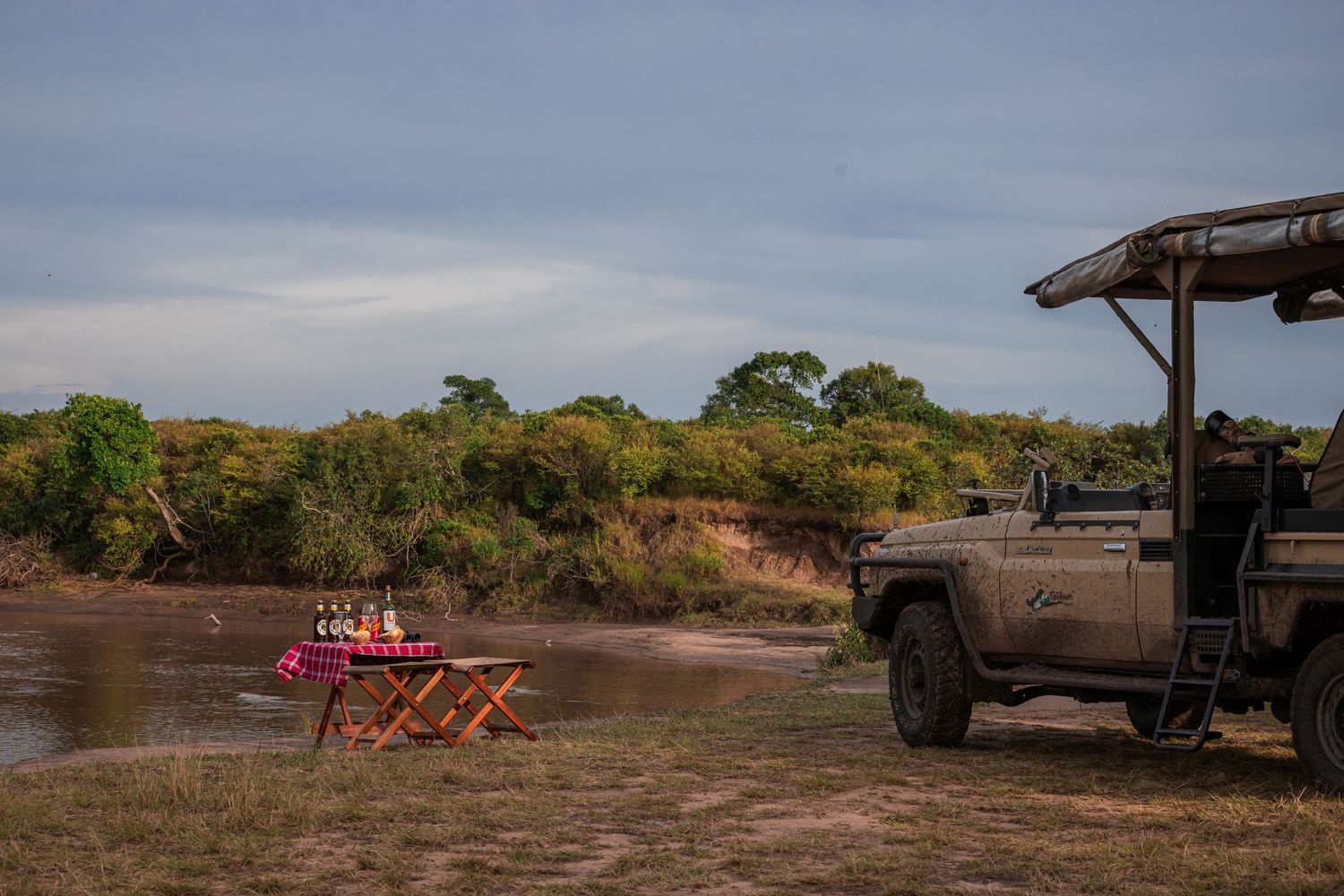 Safari vehicle at the river for sundowner