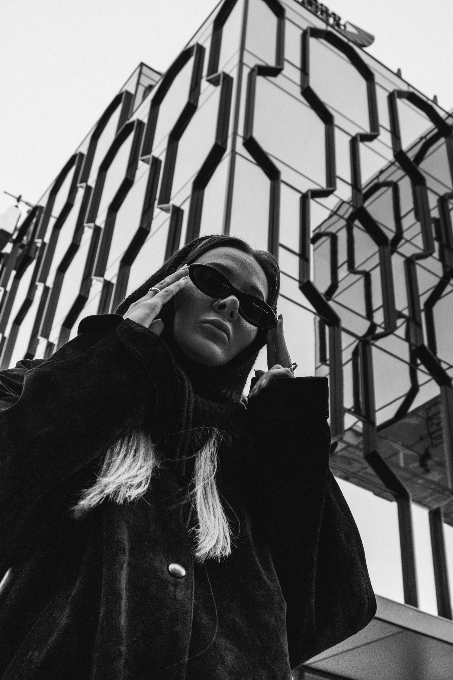 Dramatic low angle black and white architectural shot with geometric patterns.