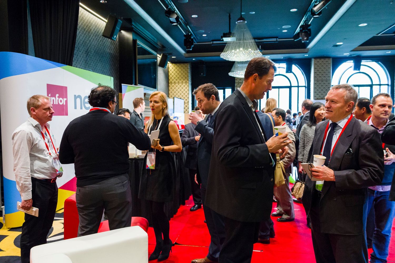 Networking session with attendees mingling on red carpet at business event at Doltone House Hyde Park.