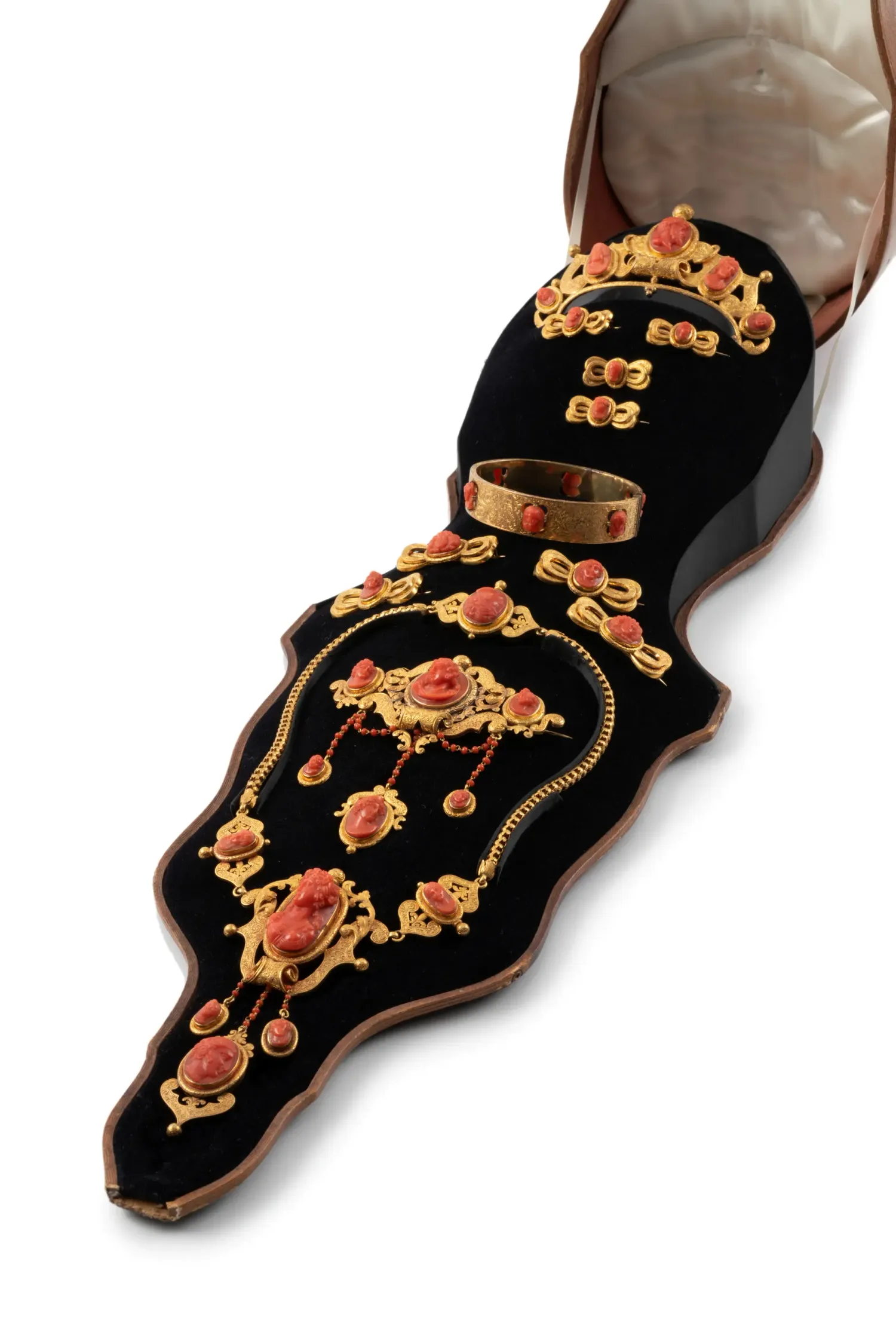 Powerhouse Museum Collection, Ornate gold and coral jewellery design on black velvet background.
